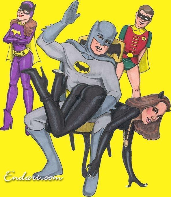 batman spanks catwoman as batgirl looks on.